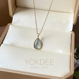 An Icy Jadeite Farbella Pear (Tear Drop Shape) Pendant in 18k gold and diamonds